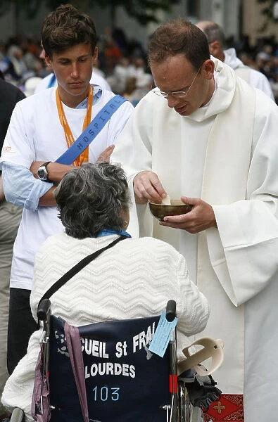 Disabled woman receiving holy communion