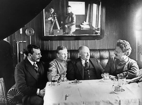 Leon trotsky (far right) entertains unidentified officials in his railway carriage office, soviet union