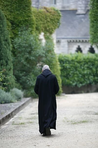 Monk walking in Saint-Pierre of Solesmes abbey