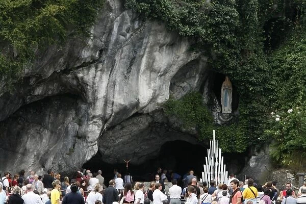 Pilgrim outside the Lourdes grotto