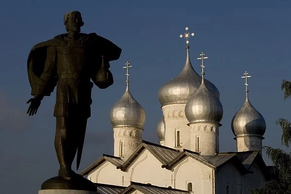 Russia, Veliky Novgorod, Alexander Nevsky statue and domes of church of Saints Boris and Gleb