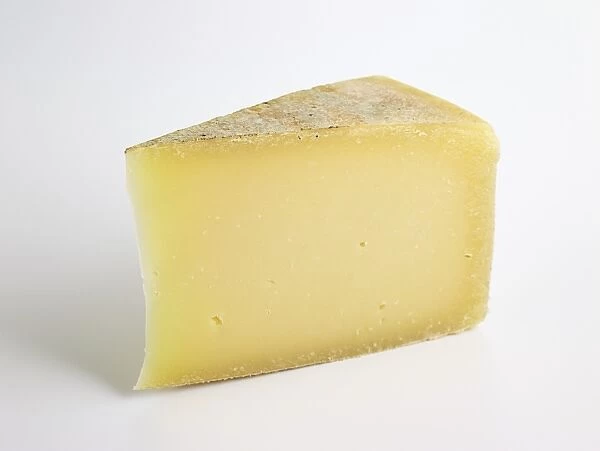 Slice of Italian Carnia cows milk cheese