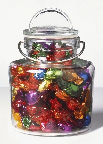 Sweet jar filled with wrapped sweets