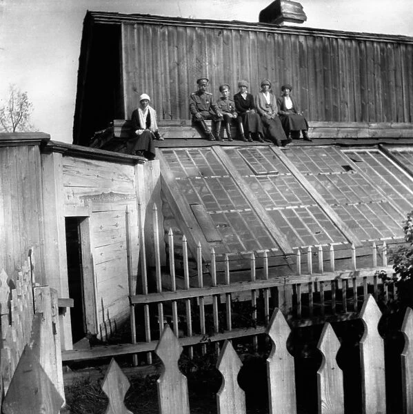 tsar nicholas ll with his family (son, alexei and daughters, olga, maria, anastasia and tatiana) on the roof of the house in tobolsk where they were held in 1918 before being transferred to yekaterinberg (sverdlovsk) to be shot