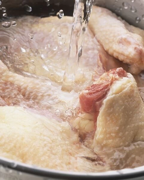 Wash the chicken pieces thoroughly in a few changes of water