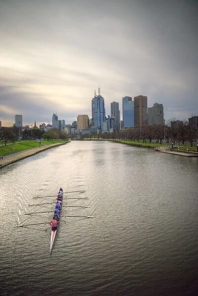Canoeing on river Yarra with Melbourne skyline