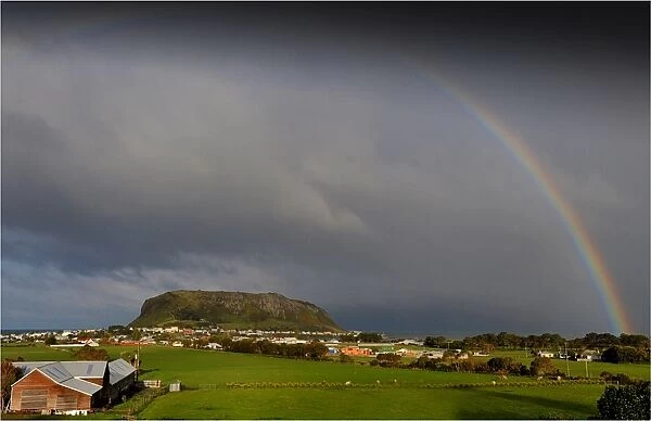 Rainbow appearing over Circular head at Stanley, in the northern area of the island state, Tasmania, Australia