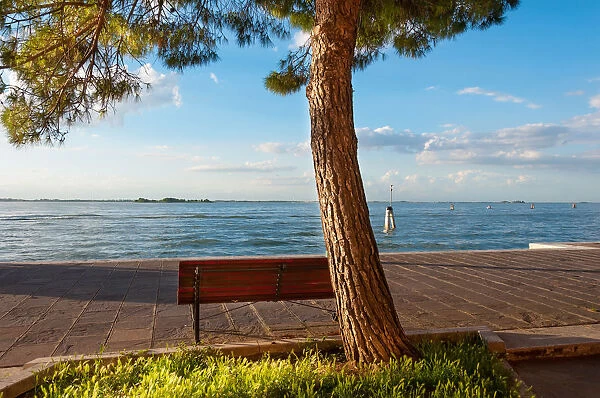 A bench in the quiet place in front of Venice lagoon