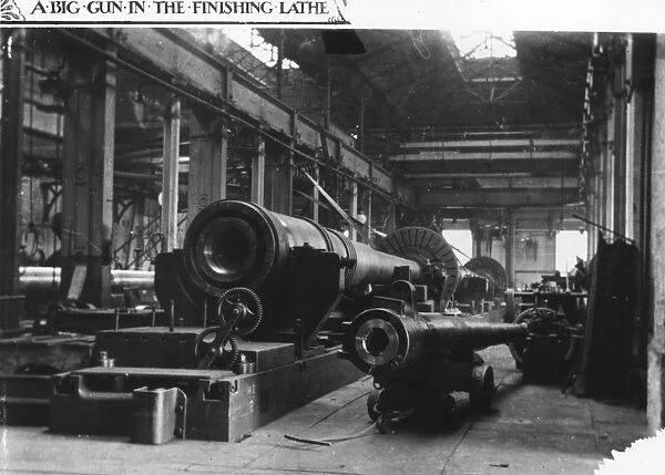 Big Gun. circa 1910: A big gun in the finishing lathe