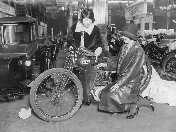 Bike Show. October 1928: Billy Painter examining a BSA motorcycle at the