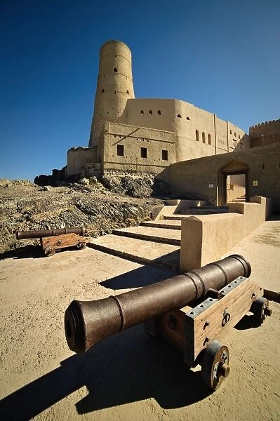 Canons guard the entrance to Bahla Fort, a UNESCO World Heritage Site in Northern Oman