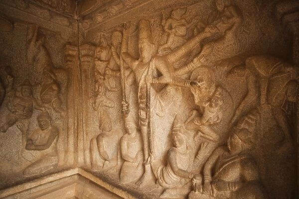 Carving details of Trivikrama the Vamana avatar of Vishnu with one leg on the earth and the other on the skie at Varaha Cave Temple, Mahabalipuram, Kanchipuram District, Tamil Nadu, India