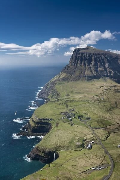 Cliffs and a small village, Gasadalur, Vagar, Faroe Islands, Denmark