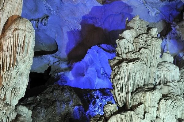 Colourfully, illuminated rock formation in Hang Sung Sot cave, Surprise Cave, Cave of Awe, a UNESCO World Heritage Site, stalactite cave in Halong Bay, Vietnam, Southeast Asia, Asia