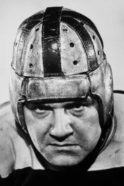 FOOTBALL PLAYER IN LEATHER HELMET, 1920s