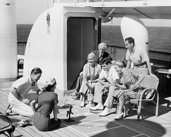 Group of people playing game on deck, of cruise ship B&W), (B&W)