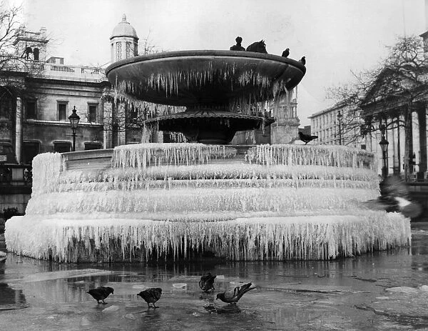 Ice Cake. 14th January 1963: The fountains in Trafalgar Square have frozen