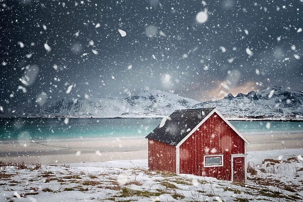 Lonely red house under the snow, Norway
