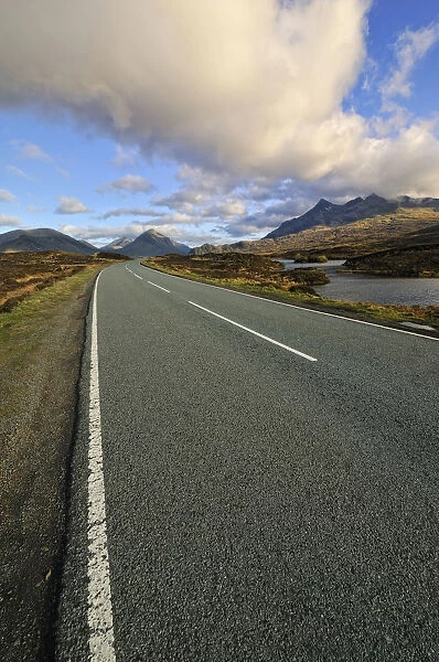 Lonesome road neat to Loch nan Eilean near Sligachan with view of Bruach na Frthe and Sgurr nan Gillean Mountain Peaks of the Black Cuillins Mountain Range, Isle of Skye, Scotland, United Kingdom