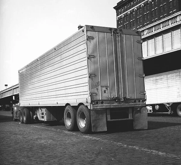 Lorry in parking lot, (rear view), (B&W)
