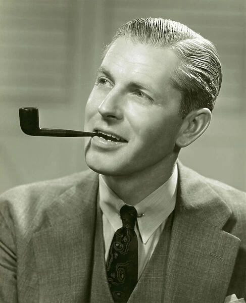 Man in suit smoking pipe