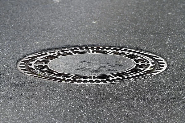 A manhole cover, round