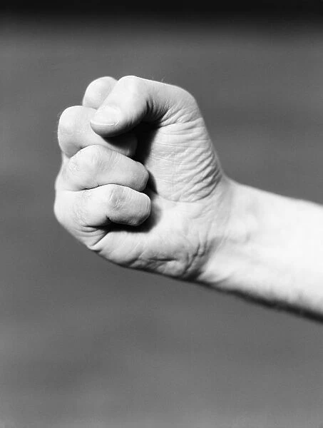 Fist. UNITED STATES - CIRCA 1930s: Mans hand making fist