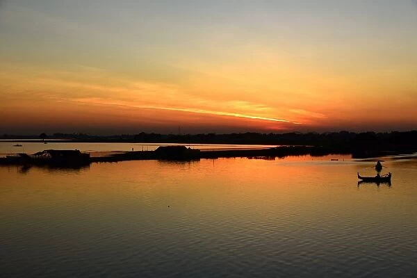 Myanmar sunset on Taugthaman lake