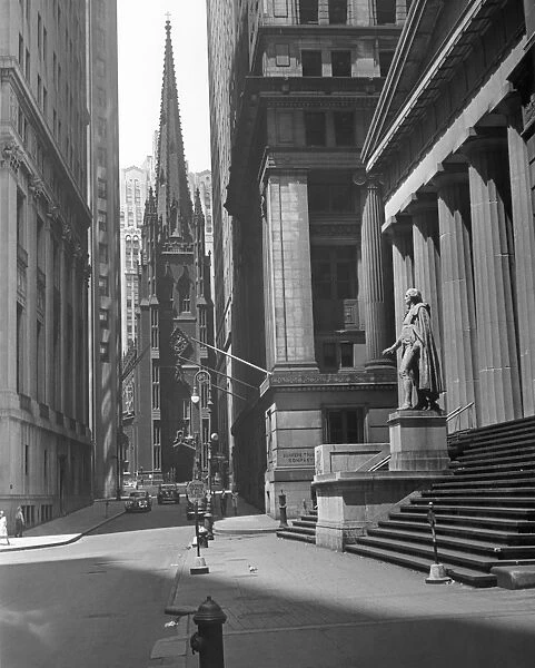 New York. View up Wall St. of Trinity Ch