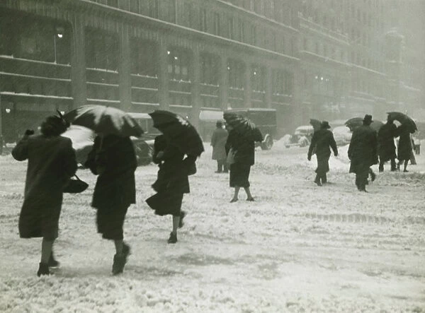 People in city, walking in blizzard, (B&W)