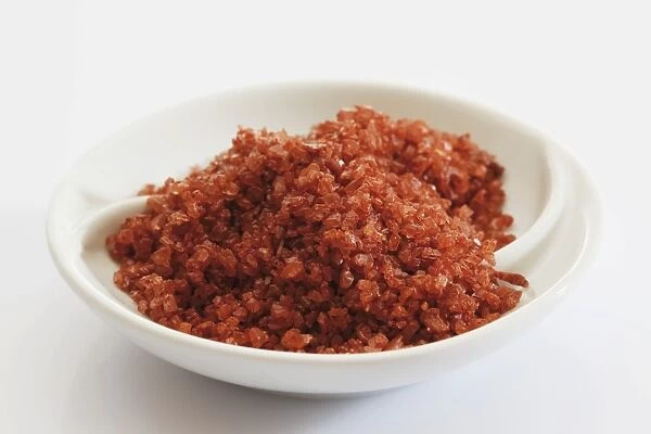 Red Hawaiian sea salt in a small porcelain bowl