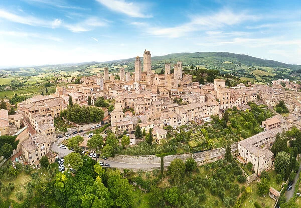 San Gimignano from above, panoramic aerial view from town to country. Tuscany, Italy