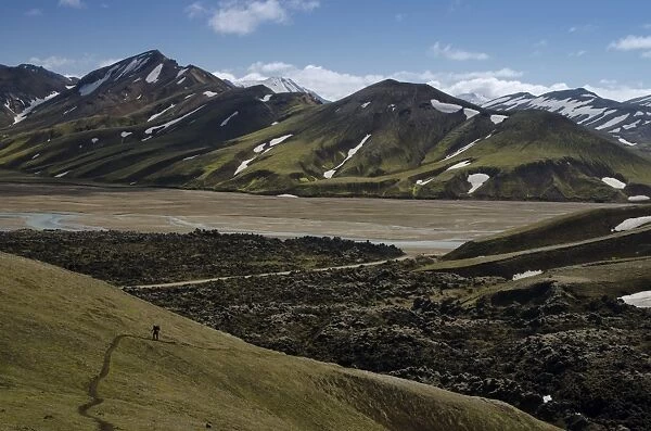 Snow-capped rhyolite mountains, Namshraun lava field, Joekulgilskvisl river, Landmannalaugar, Fjallabak Nature Reserve, Highlands, Iceland, Europe