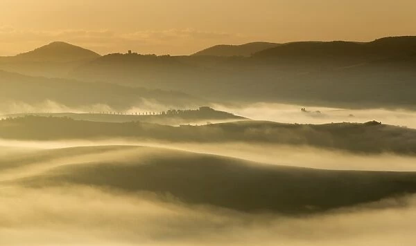 Soft Mist. Mist hills at Dawn. San Quirico d Orcia is a comune (municipality)of c