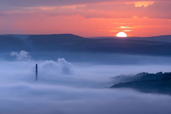 Sunrise over a foggy Castleton, English Peak District. UK