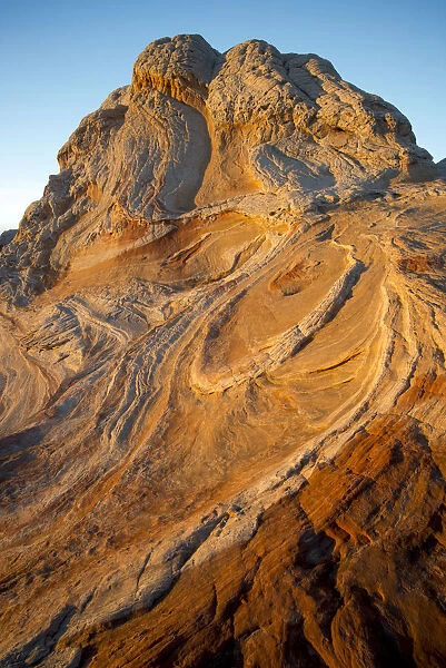 Sunset on abstract designs of geological formation found in Vermillion Cliffs National Monument, Arizona, USA