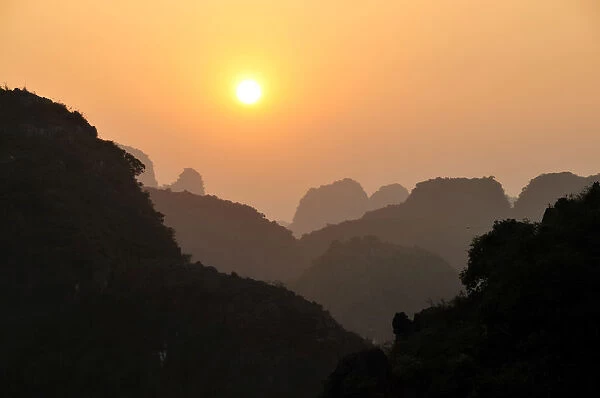 Sunset in the dry Halong Bay, Ninh Binh area, Vietnam, Southeast Asia
