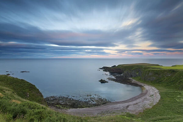 Sunset at Dunnottar Castle on the Scottish coast with moving cloud - Scotland Europe