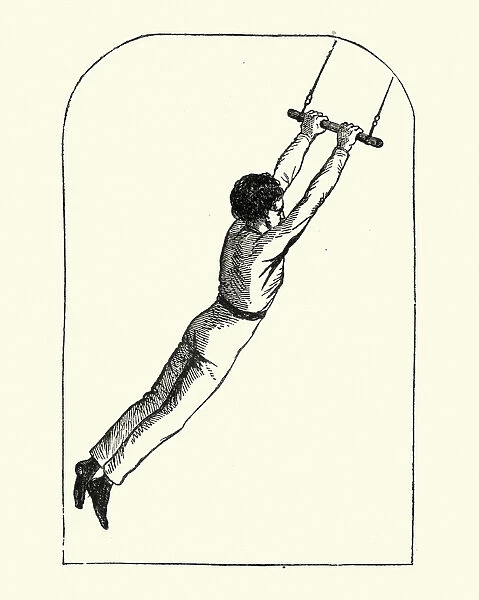 Victorian boy swinging on a trapeze