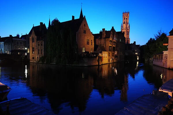 A view of Bruges old city and its canals at dusk
