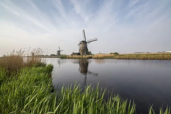 Windmill reflected in the canal Holland