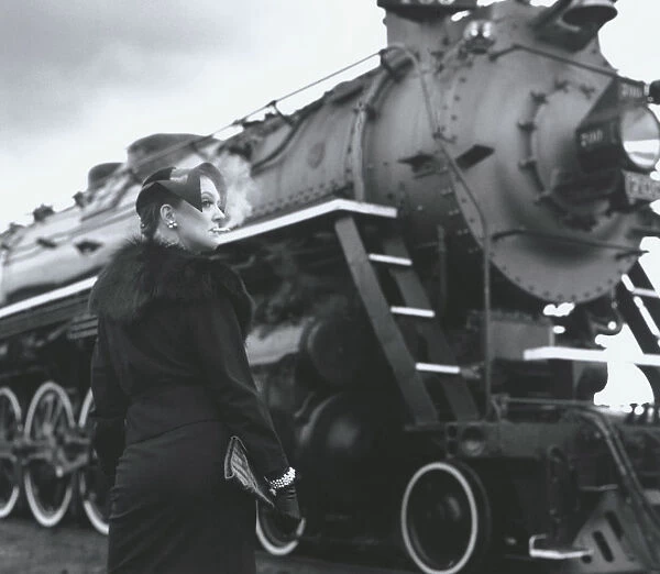 Woman Smoking by Steam Engine