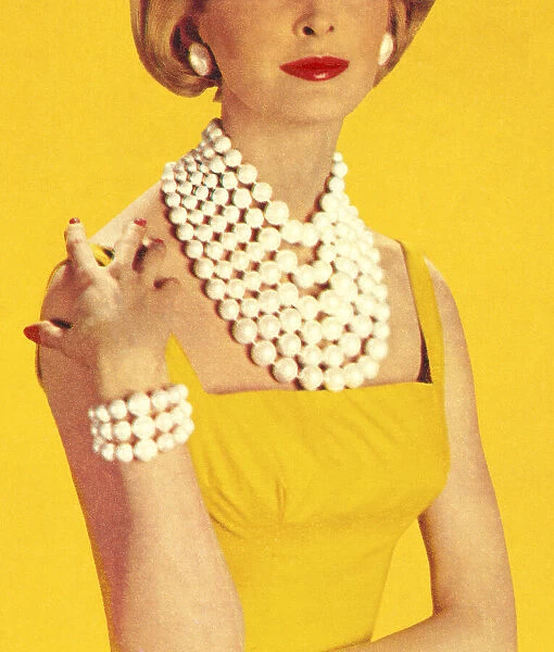 Woman Wearing Jewelry and a Yellow Dress