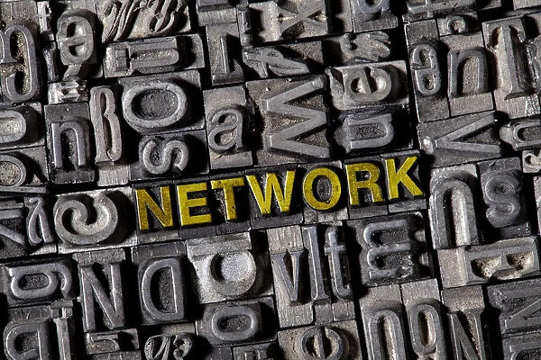 The word NETWORK among on the letterpress letters