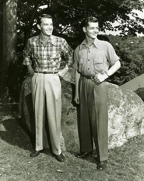 Two young men standing outdoors, (B&W)