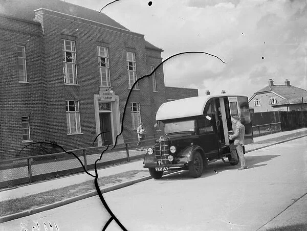 Loading books onto the mobile library outside the Kent County Library in Blackfen