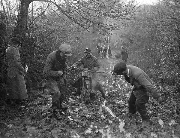 Riders buried in mud at Horsham motor cycle trials. Many well known riders of the