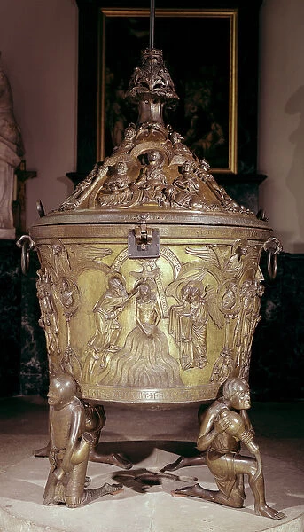 Baptismal font showing a relief panel of the Baptism of Christ