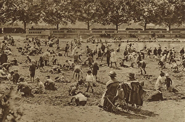 The beach without a sea: castles in the sand in Bishops Park by the river at Fulham (b  /  w photo)