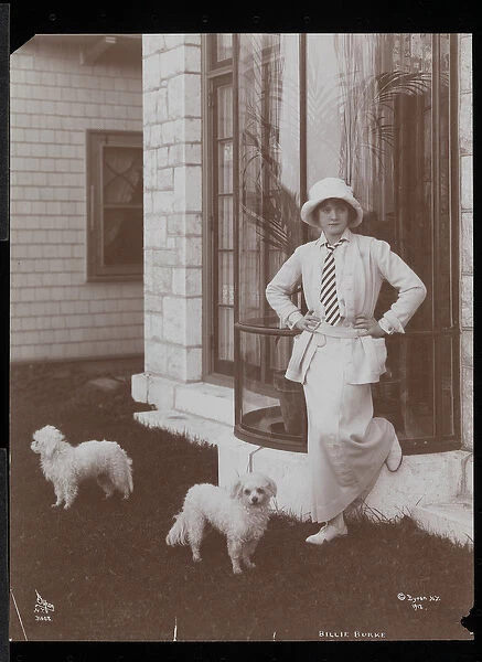 Billie Burke and two dogs at Burkeleigh Crest, her house in Hastingson, New York